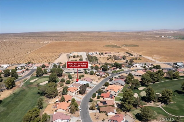 bird's eye view featuring view of desert and a rural view