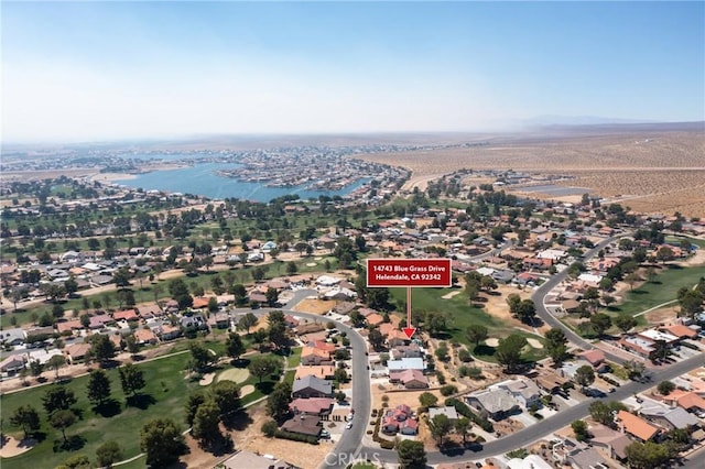 aerial view with a residential view and a water view