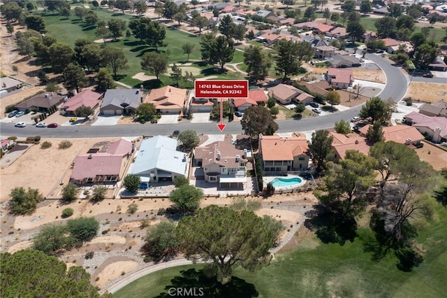 birds eye view of property with a residential view