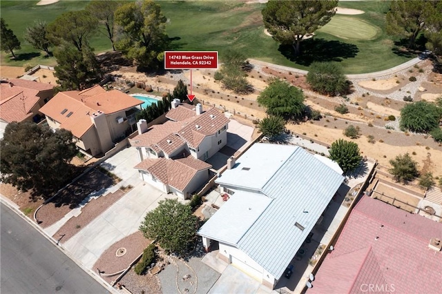 bird's eye view with view of golf course