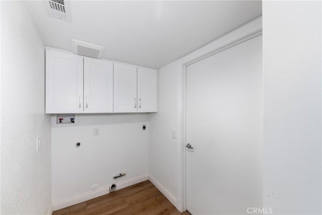 laundry room featuring electric dryer hookup, visible vents, gas dryer hookup, cabinet space, and hookup for a washing machine