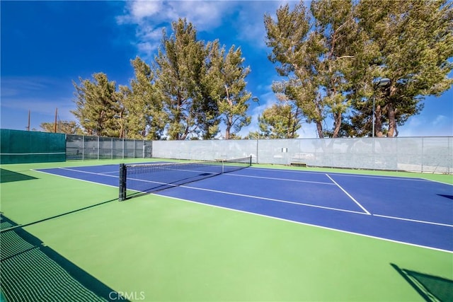 view of sport court featuring community basketball court and fence