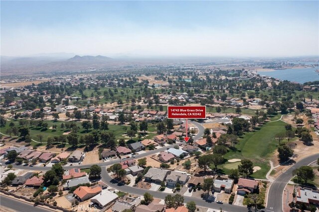 bird's eye view with a water and mountain view