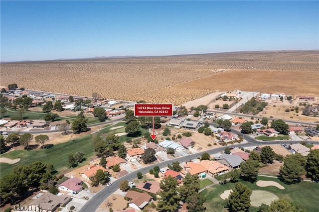 bird's eye view with a mountain view and view of desert