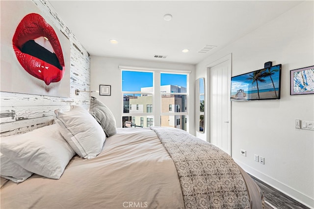 bedroom with hardwood / wood-style floors