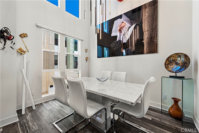 dining area with dark hardwood / wood-style floors