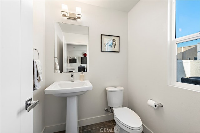 bathroom with tile patterned floors and toilet