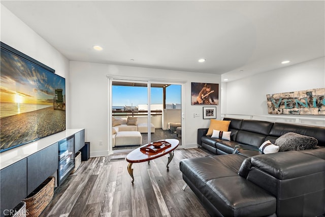 living room with dark hardwood / wood-style flooring