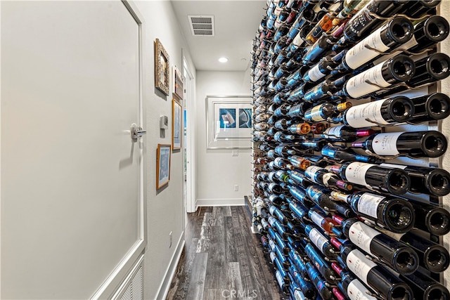 wine area with dark hardwood / wood-style floors