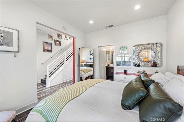 bedroom featuring wood-type flooring and ensuite bathroom