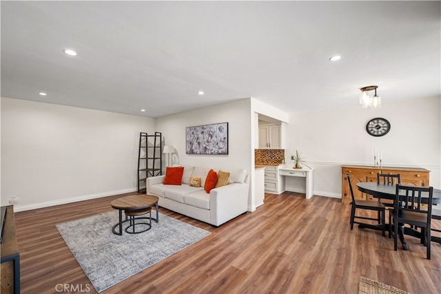 living room with wood-type flooring and sink