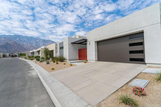 view of front of house with a mountain view and a garage