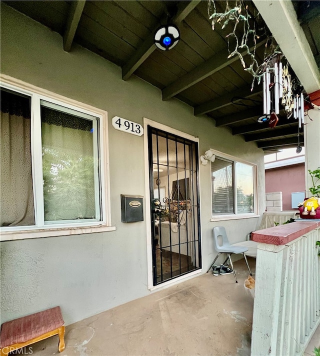 view of exterior entry featuring ceiling fan