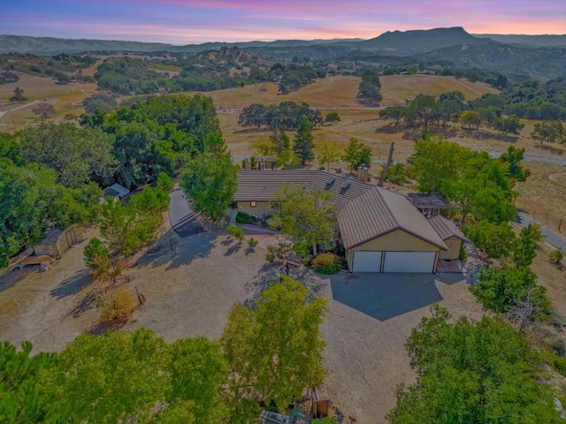 aerial view at dusk with a mountain view