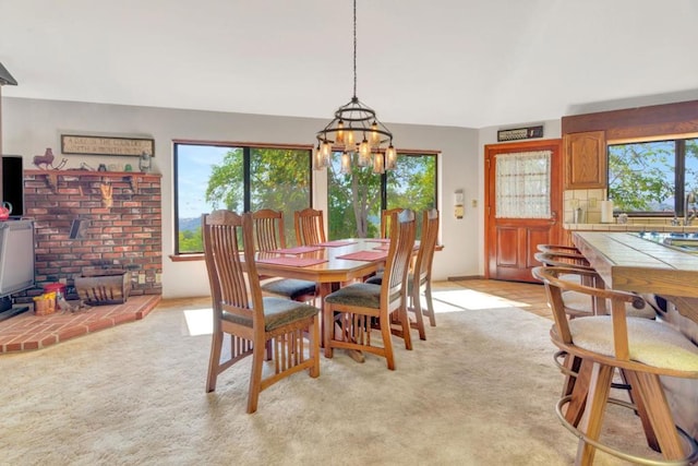 dining space featuring a wood stove, light carpet, and a chandelier