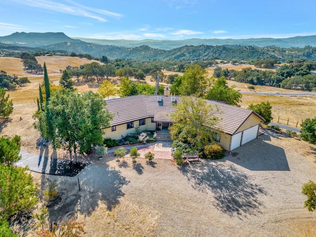 birds eye view of property featuring a mountain view