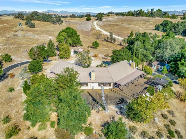 birds eye view of property with a mountain view