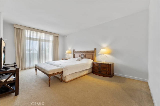 bedroom featuring light carpet