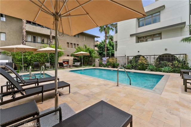 view of swimming pool with a patio