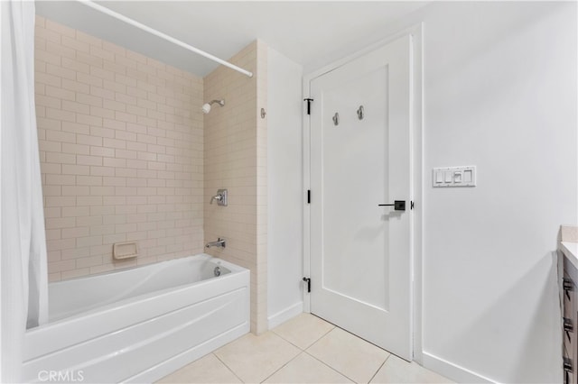 bathroom with shower / tub combo, vanity, and tile patterned floors