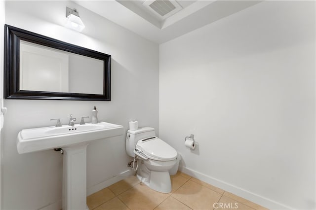 bathroom featuring tile patterned floors and toilet