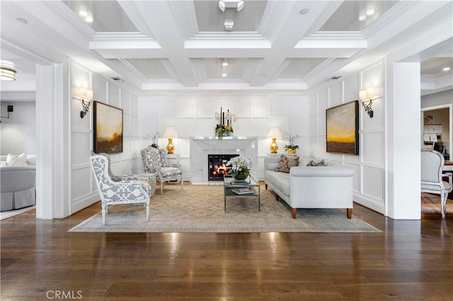 living room with beam ceiling, coffered ceiling, dark hardwood / wood-style floors, and a high end fireplace