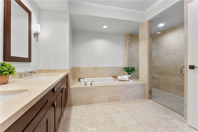 bathroom featuring shower with separate bathtub and vanity