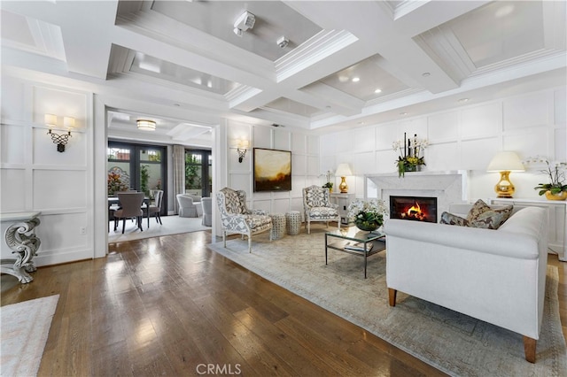 living room with coffered ceiling, beamed ceiling, dark hardwood / wood-style flooring, and a high end fireplace