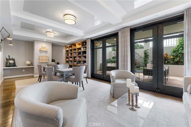 interior space with wood-type flooring and crown molding