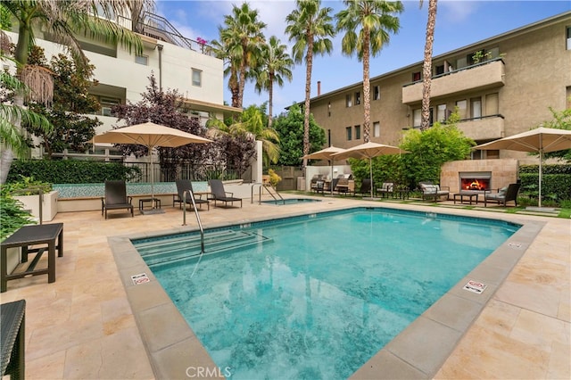 view of swimming pool with a patio area