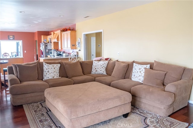 living room with dark hardwood / wood-style floors