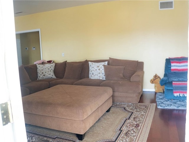 living room with dark hardwood / wood-style floors