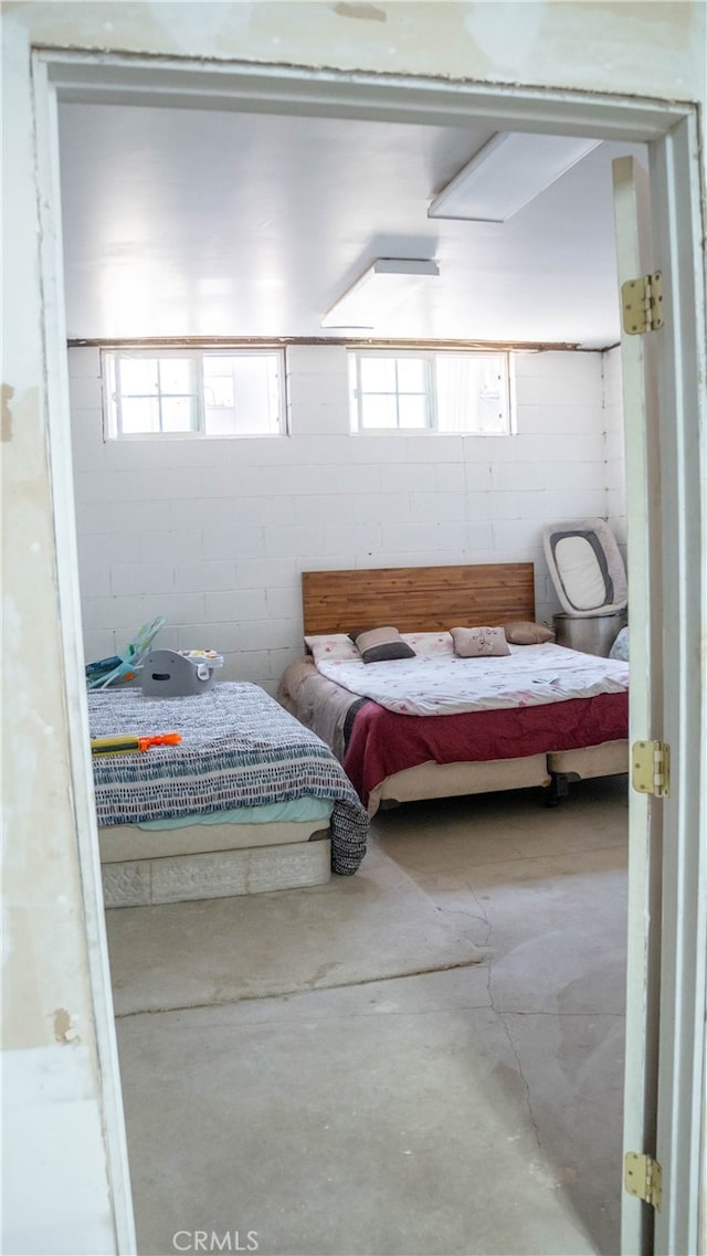 bedroom with concrete flooring