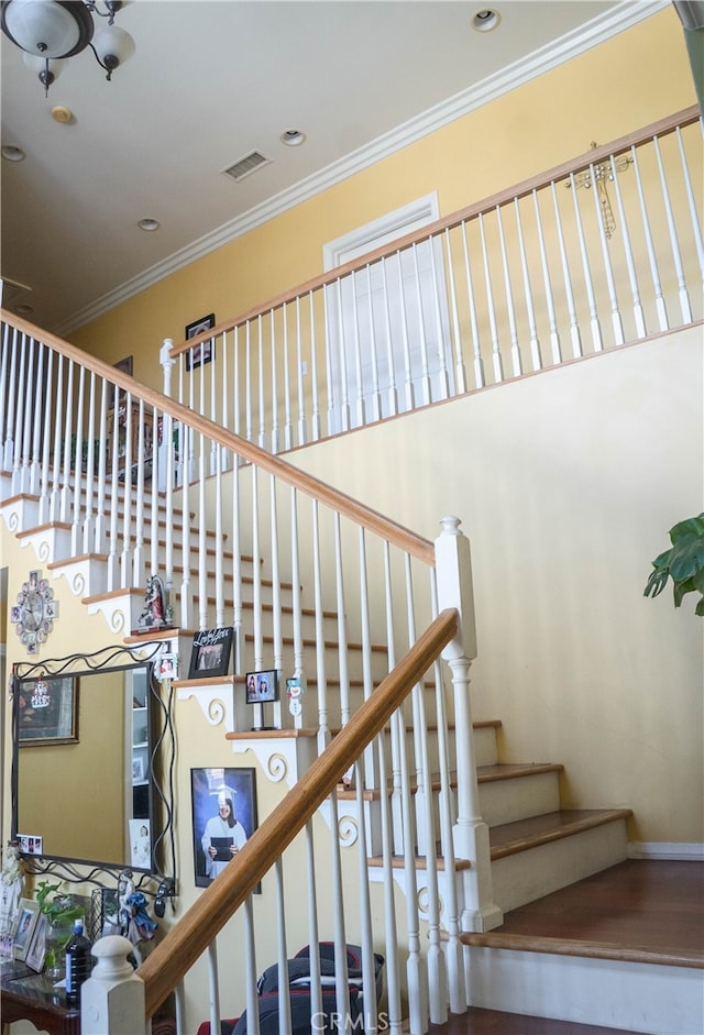 stairway with crown molding