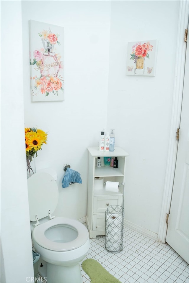 bathroom featuring tile patterned flooring and toilet