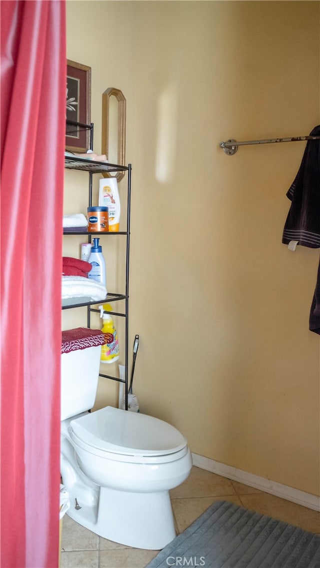 bathroom featuring tile patterned floors and toilet