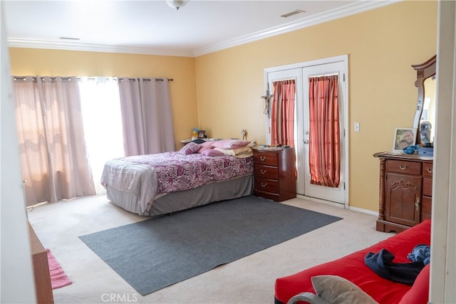 carpeted bedroom featuring crown molding