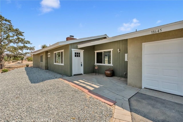 single story home with a garage