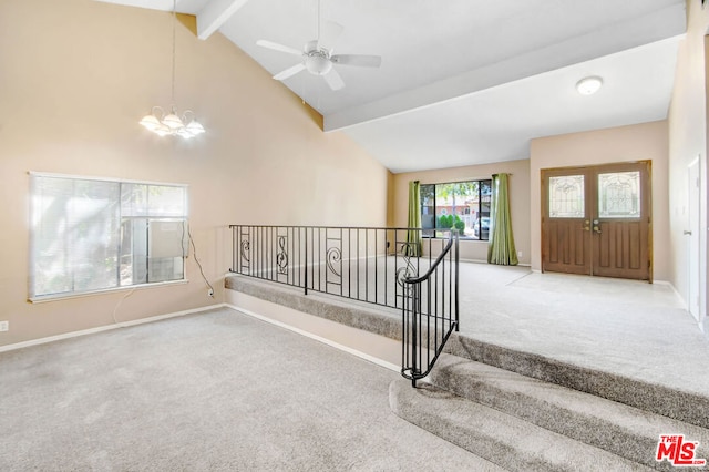 stairway featuring ceiling fan with notable chandelier, beam ceiling, carpet floors, and high vaulted ceiling