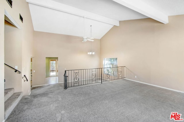 unfurnished living room featuring beam ceiling, ceiling fan, carpet floors, and high vaulted ceiling