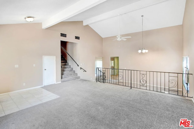 unfurnished room featuring carpet, beam ceiling, high vaulted ceiling, and ceiling fan