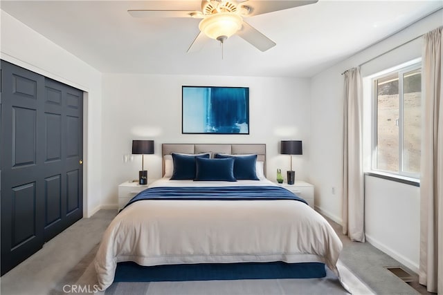 bedroom featuring ceiling fan and light colored carpet