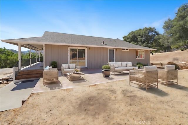 back of property with an outdoor hangout area and a patio