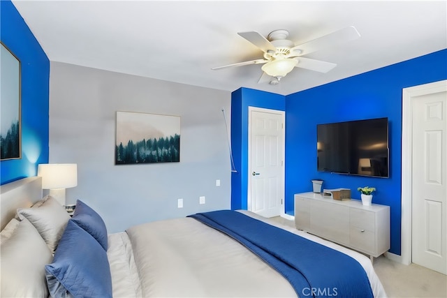 carpeted bedroom featuring ceiling fan