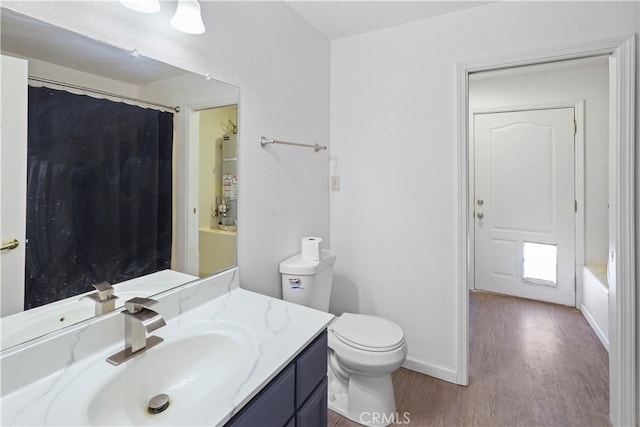 full bathroom featuring water heater, shower / bathtub combination with curtain, vanity, wood-type flooring, and toilet