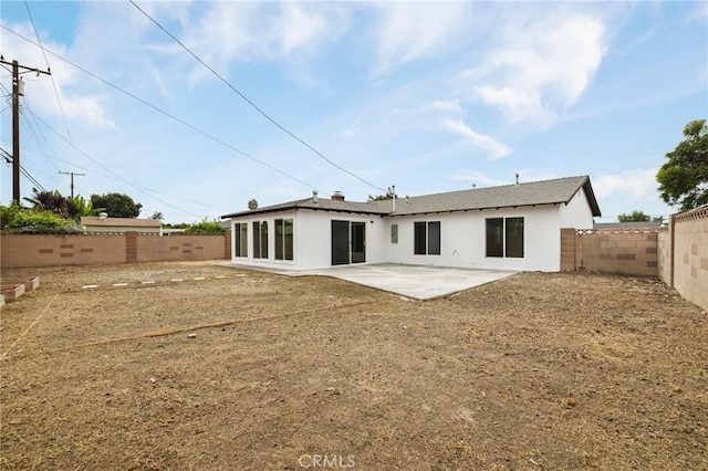 back of property featuring a patio area