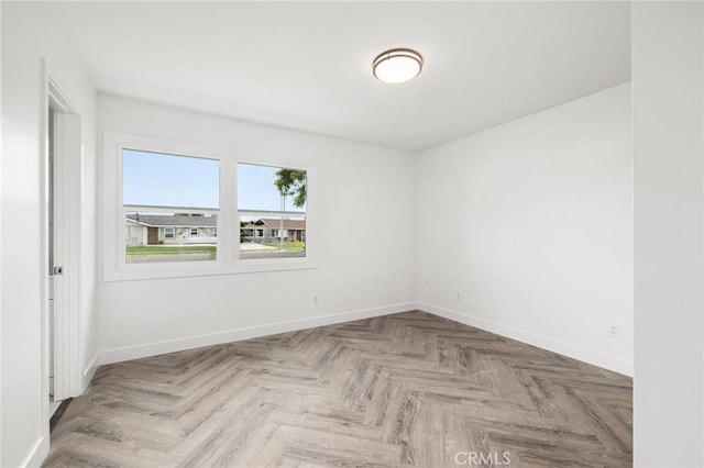 unfurnished room featuring light parquet floors