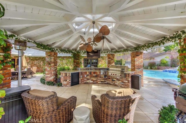 view of patio / terrace with a grill, ceiling fan, and area for grilling