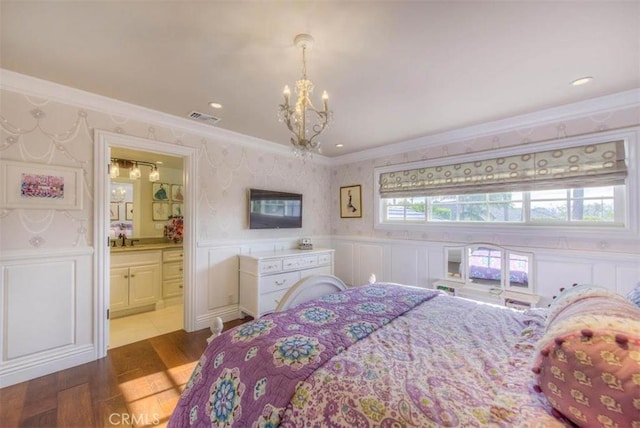 bedroom featuring sink, a chandelier, hardwood / wood-style flooring, and crown molding