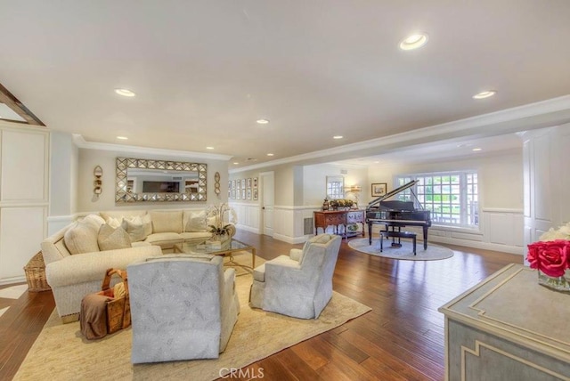 living room with hardwood / wood-style floors and crown molding